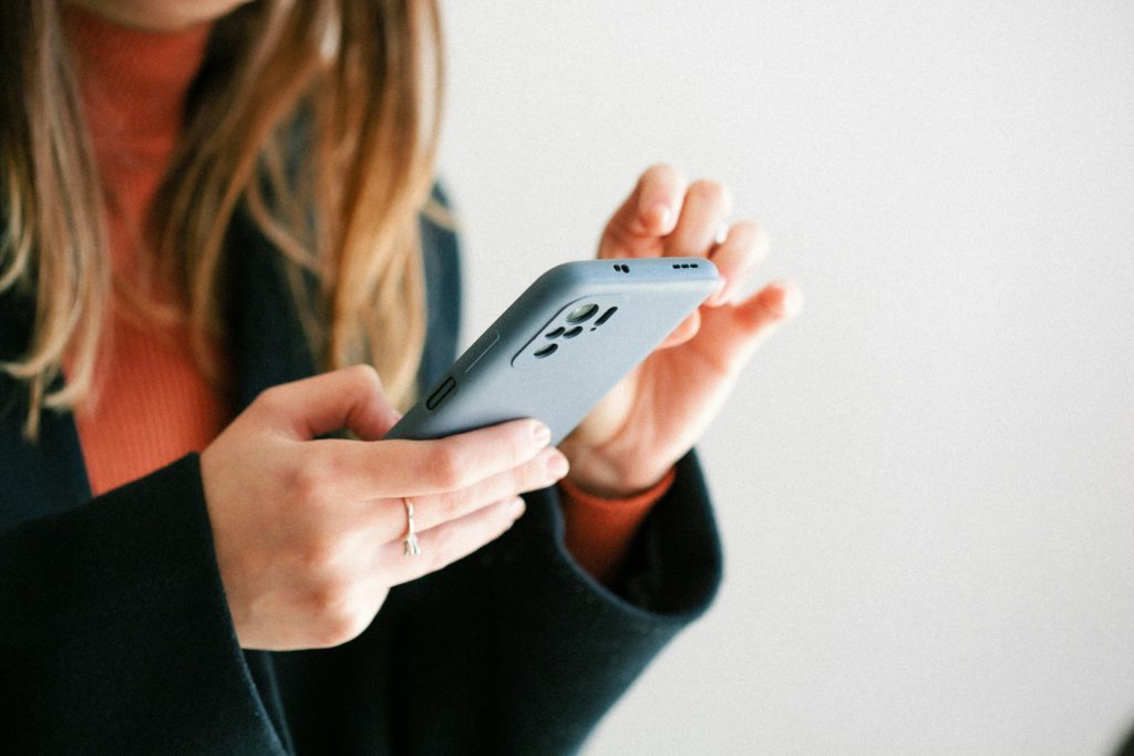 woman looking at mobile phone