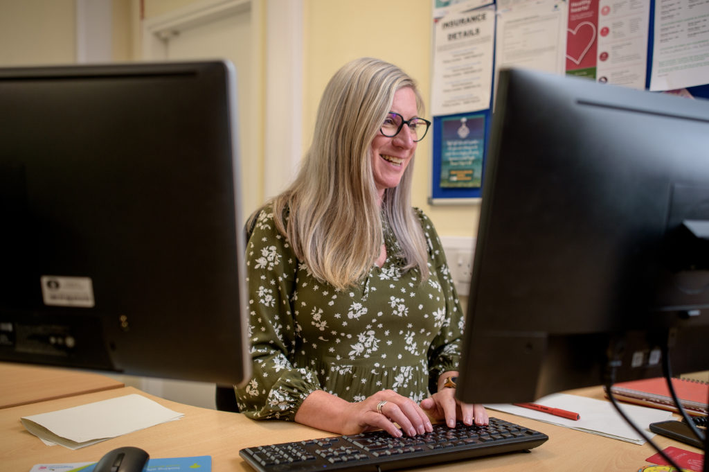 woman looking at computer screen